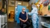 KAZAKHSTAN -- An elderly man receives a dose of the Sputnik V (Gam-COVID-Vac) vaccine against the coronavirus disease at a vaccination point in the Abylkhan Kasteyev State Museum of Arts in Almaty on April 17, 2021