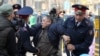 KAZAKHSTAN -- Police officers detain an anti-government protester during a rally in Almaty, Kazakhstan March 22, 2019. 